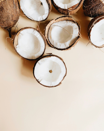 A couple coconuts split in half.